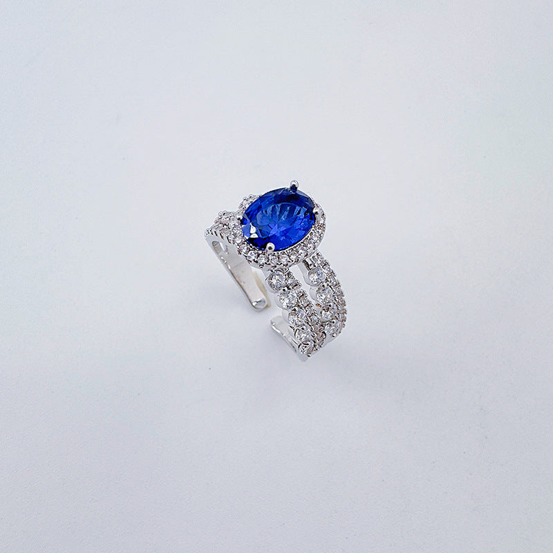 Open-end ring with blue cat's eye stones