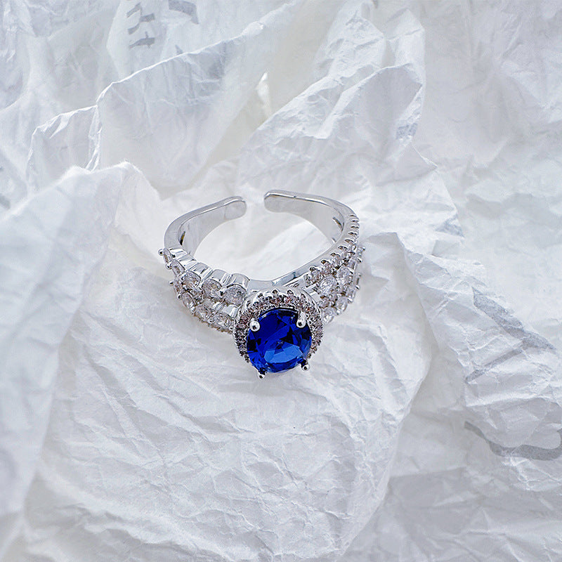 Open-end ring with blue cat's eye stones