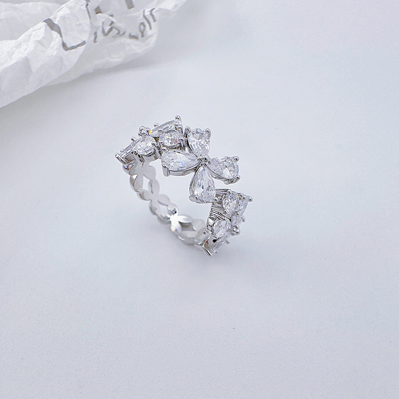 Zirconia four-petal flower open-end ring