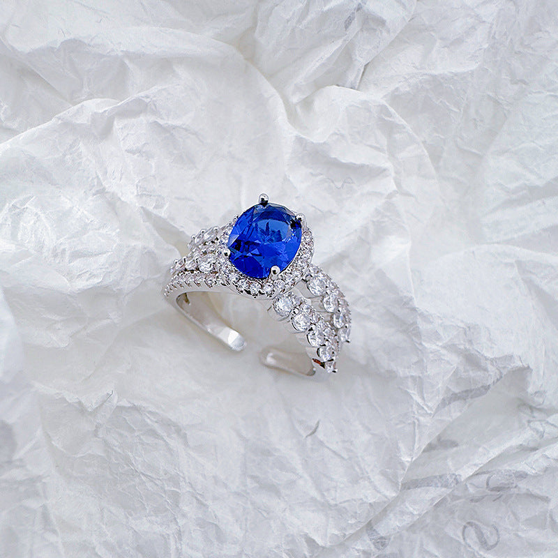 Open-end ring with blue cat's eye stones