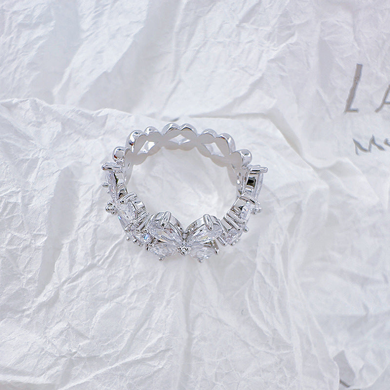 Zirconia four-petal flower open-end ring