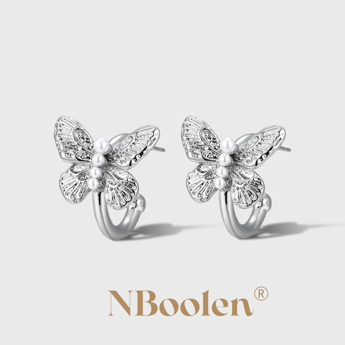 Butterfly-shaped pearl-set C-shaped earrings